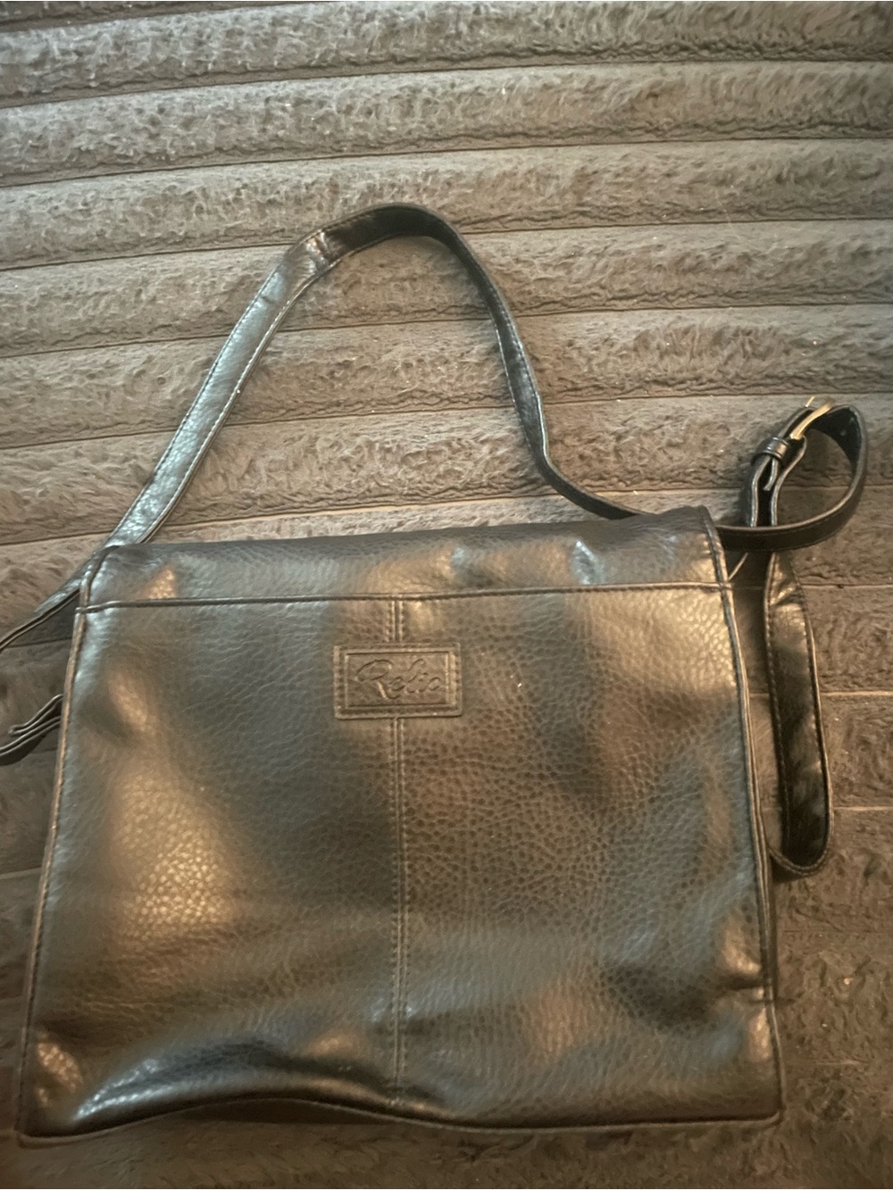 RELIC Erica black faux leather crossbody bag.